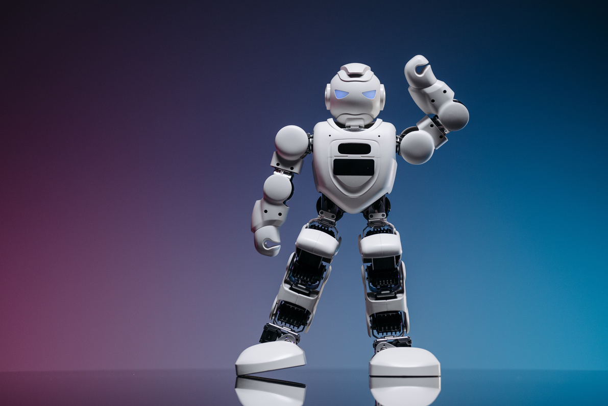 Close Up Shot of White Toy Robot