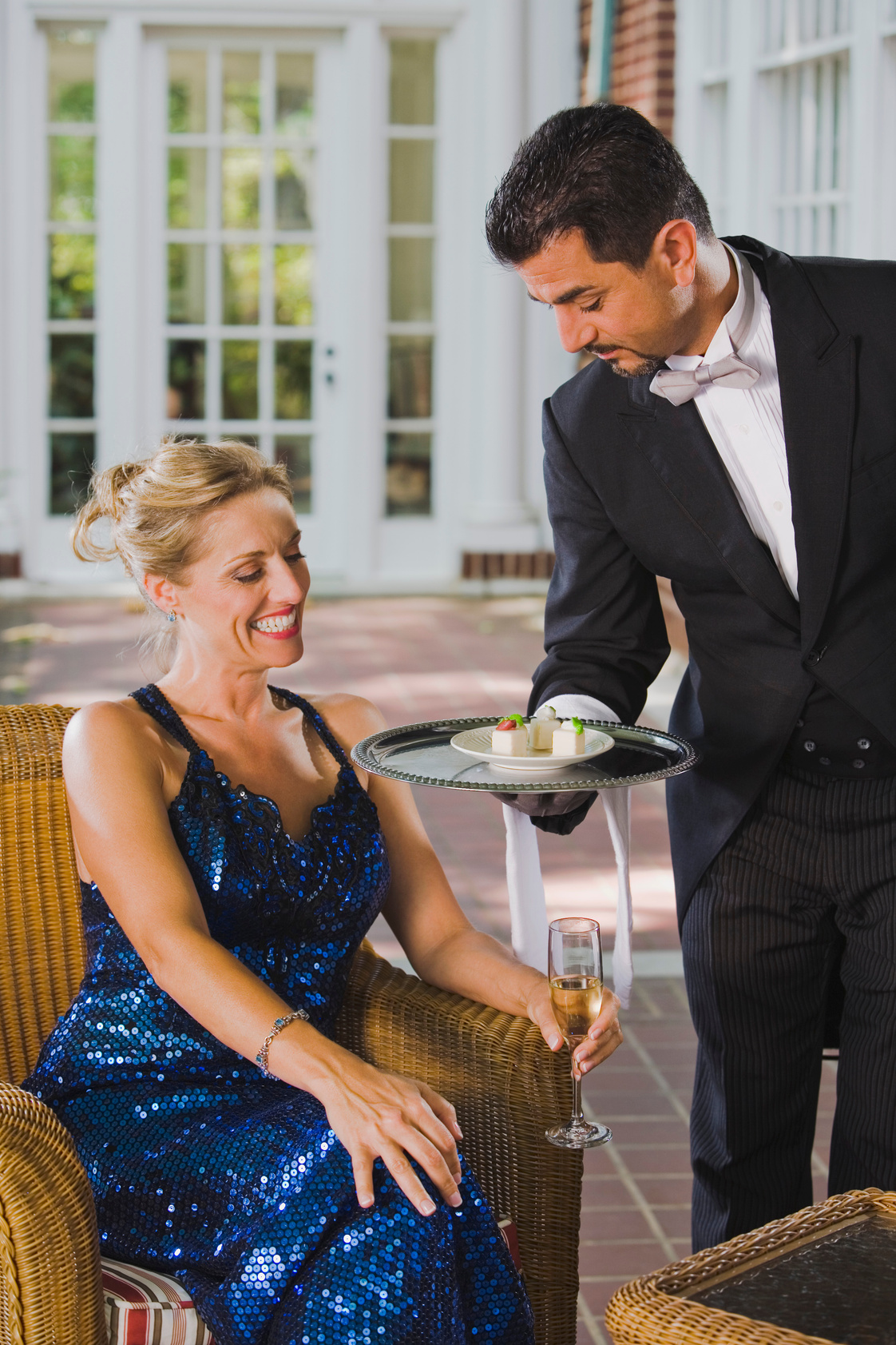 Butler serving woman